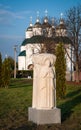 Stone sculpture on green grass