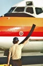 PSA Pacific Southwest Airlines Ramp service agent works a McDonnell Douglas MD-80 upon arrival at San Diego Airport.