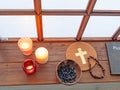 psalter, candles and rosary beside old window in monastery Royalty Free Stock Photo