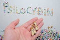 Psilocybin inscription. Psychedelic mushrooms on textured background in man's hand.