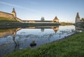 Pskov Kremlin from the side of the Pskova river at sunrise. Royalty Free Stock Photo