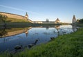 Pskov Kremlin from the side of the Pskova river at sunrise. Royalty Free Stock Photo