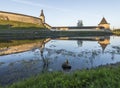 Pskov Kremlin from the side of the Pskova river at sunrise. Royalty Free Stock Photo