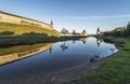 Pskov Kremlin from the side of the Pskova river at sunrise. Royalty Free Stock Photo