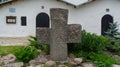 Ancient cross near the temple and the Pokrovskaya tower