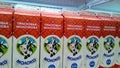 Milk with fat content of 2.5 percent in carton packaging on supermarket shelves. Dairy products. Sale, shopping, consumerism conce