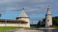 Pskov Kremlin. The bell tower of the Trinity Cathedral. Towers of Pskov Krom and the Roundabout city at the mouth of the Pskov riv Royalty Free Stock Photo