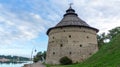 Pokrovskaya fortress tower on the shore of the Velikaya river on a sunny day