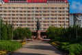 Pskov, Russia, September 6, 2023. Monument to Saint Princess Olga against the backdrop of a large hotel.