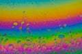 Psychedelic abstract planet from soap bubble, Light refraction on a soap bubble, Macro Close Up moving particles Rainbow colors on