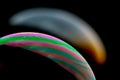 Psychedelic abstract planet from soap bubble, Light refraction on a soap bubble, Macro Close Up moving particles Rainbow colors on