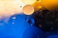 Psychedelic blueand yellow oil and water abstract background. Abstract colorful background. Foam of Soap with Bubbles macro shot.