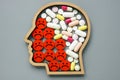 Psychiatric medication for depression. Head, negative emoticons and pills. Royalty Free Stock Photo