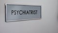 Psychiatrist room door, door table closeup, depression treatment, healthcare