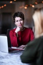 Psychiatrist woman doctor listens a young woman her patient carefuly on her emotional problem or living situation