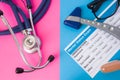 Psychiatry mental status exam, hourglass, reflex hummer and medical stethoscope in two colors background: blue and pink. Concept o