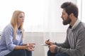 Psychoanalyst listening to depressed woman talking about her troubles