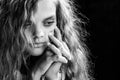 Psychological black and white portrait of a girl on a black background