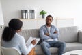 Psychological counselling. Black male patient with depression having session with psychotherapist at office Royalty Free Stock Photo