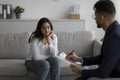 Psychological help service. Depressed arab woman having psychotherapy session with counselor at mental health clinic Royalty Free Stock Photo