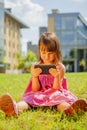 Psychological image of cute little girl addicted to likes: Social networks feeds her neediness. Portrait of nervous child with Royalty Free Stock Photo