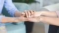 Psychologist consoling her client, holding her hands Royalty Free Stock Photo