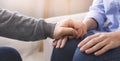 Psychologist consoling his female patient at personal therapy Royalty Free Stock Photo