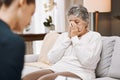 Psychologist, consulting or old woman crying in counseling with therapist writing notes in conversation. Stressed Royalty Free Stock Photo