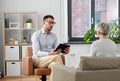 Psychologist listening to senior woman patient Royalty Free Stock Photo