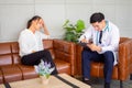 Psychologist metal health concept. Psychologist and depressed patient at office during consultation, The male doctor is treating