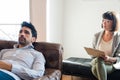 Psychologist taking notes during therapy session. Royalty Free Stock Photo