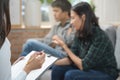 Psychologist talking with married couple about depression of husband Royalty Free Stock Photo