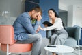 Psychologist talking with patient on therapy session. Depressed man speaking to a therapist while she is taking notes. Royalty Free Stock Photo