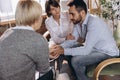 At a psychologist& x27;s appointment. Married couple, sad, depressed man and woman meeting with consultant to solve family Royalty Free Stock Photo