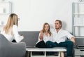 Psychologist with young couple, psychotherapist or marriage counselor listen mental health of couple. Psychological Royalty Free Stock Photo