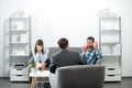 Psychologist with young couple, psychotherapist or marriage counselor listen mental health of young couple