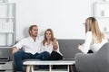 Psychologist with young couple, psychotherapist or marriage counselor listen mental health of couple. Psychological