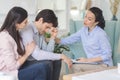 Psychologist and young woman supporting upset man during therapy