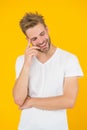 Psychology concept. Emotional handsome guy. Sexy handsome confident young man standing in white shirt. Summer and spring Royalty Free Stock Photo