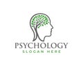 A psychology logo featuring a head silhouette filled with a tree and leaves with a slogan below it Royalty Free Stock Photo