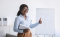 Psychology tutor or business coach giving lecture or presentation, showing thumb up sign at office, panorama