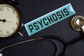 Psychosis on the print paper with Healthcare Concept Inspiration. alarm clock, Black stethoscope. Royalty Free Stock Photo