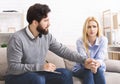 Psychotherapist comforting puzzled female patient at office