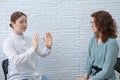 The psychotherapist conducts a hypnosis session. Female patient under hypnosis.