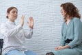The psychotherapist conducts a hypnosis session. Female patient under hypnosis.