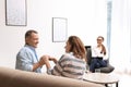 Psychotherapist and happy couple having meeting. Family counselling Royalty Free Stock Photo