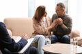 Psychotherapist and happy couple having meeting. Family counselling Royalty Free Stock Photo