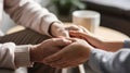 Psychotherapist offering help to patient, holding her hands during psychotherapy session, Psychological support. Close