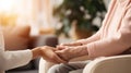 Psychotherapist offering help to patient, holding her hands during psychotherapy session, Psychological support. Close