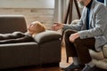 Psychotherapist supporting young caucasian woman during appointment Royalty Free Stock Photo